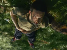 thumbnail: boy lying on grass